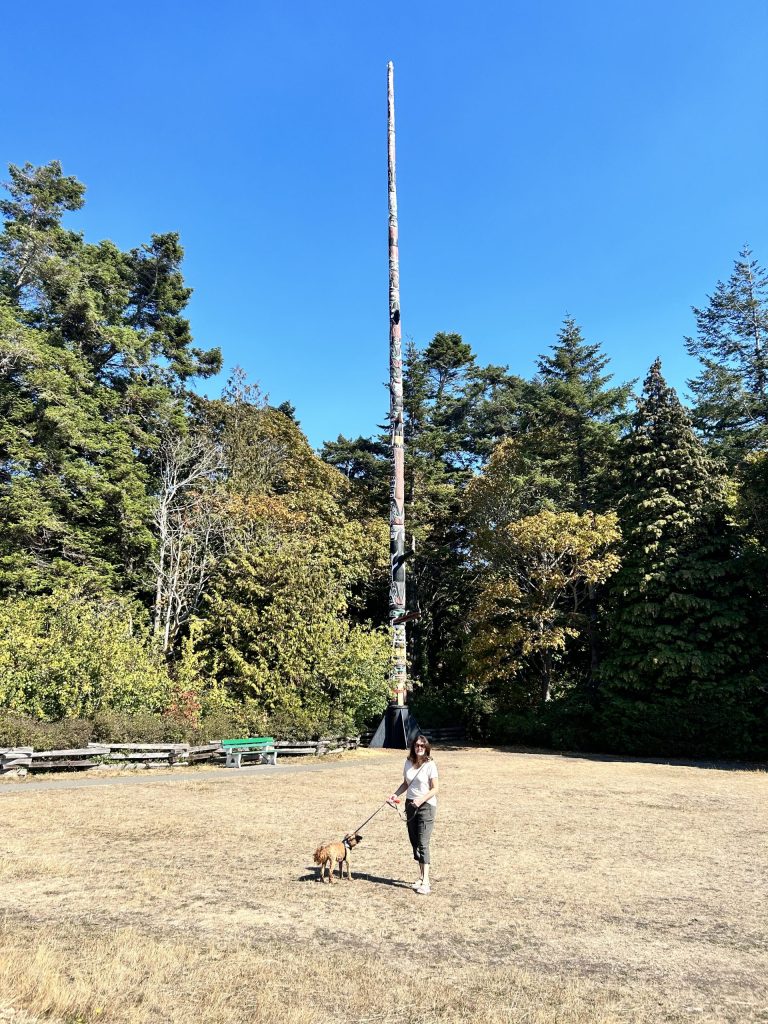 Laura's cousin provides scale to the Story Pole.