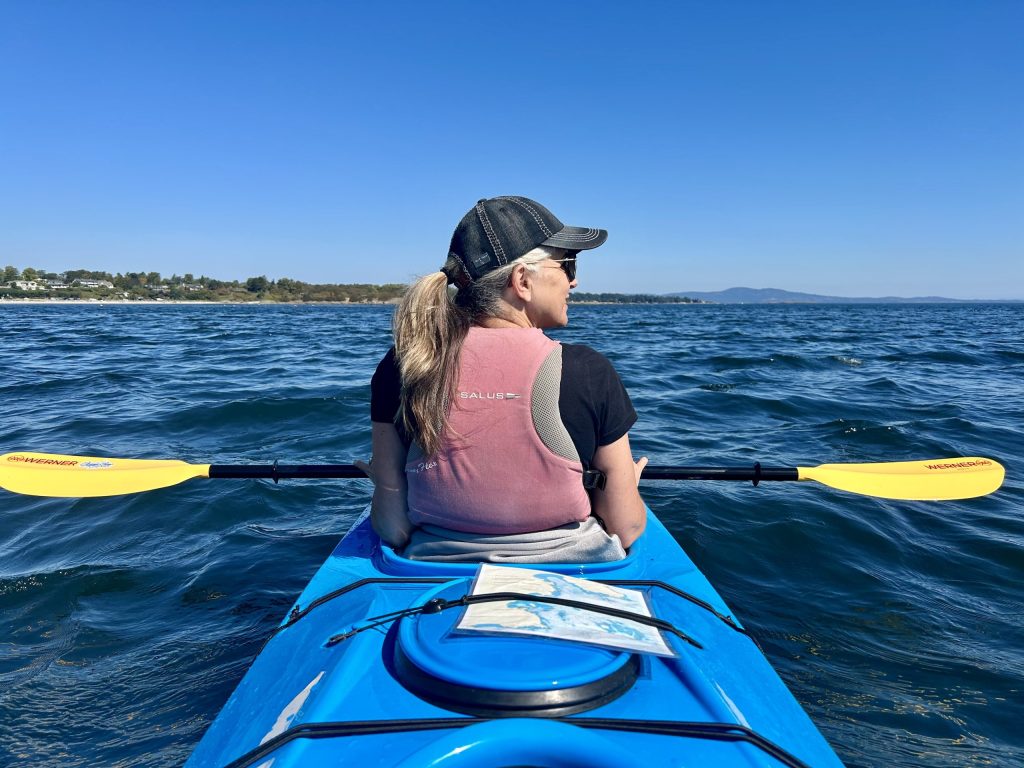 Laura's charting a course while ocean kayaking!