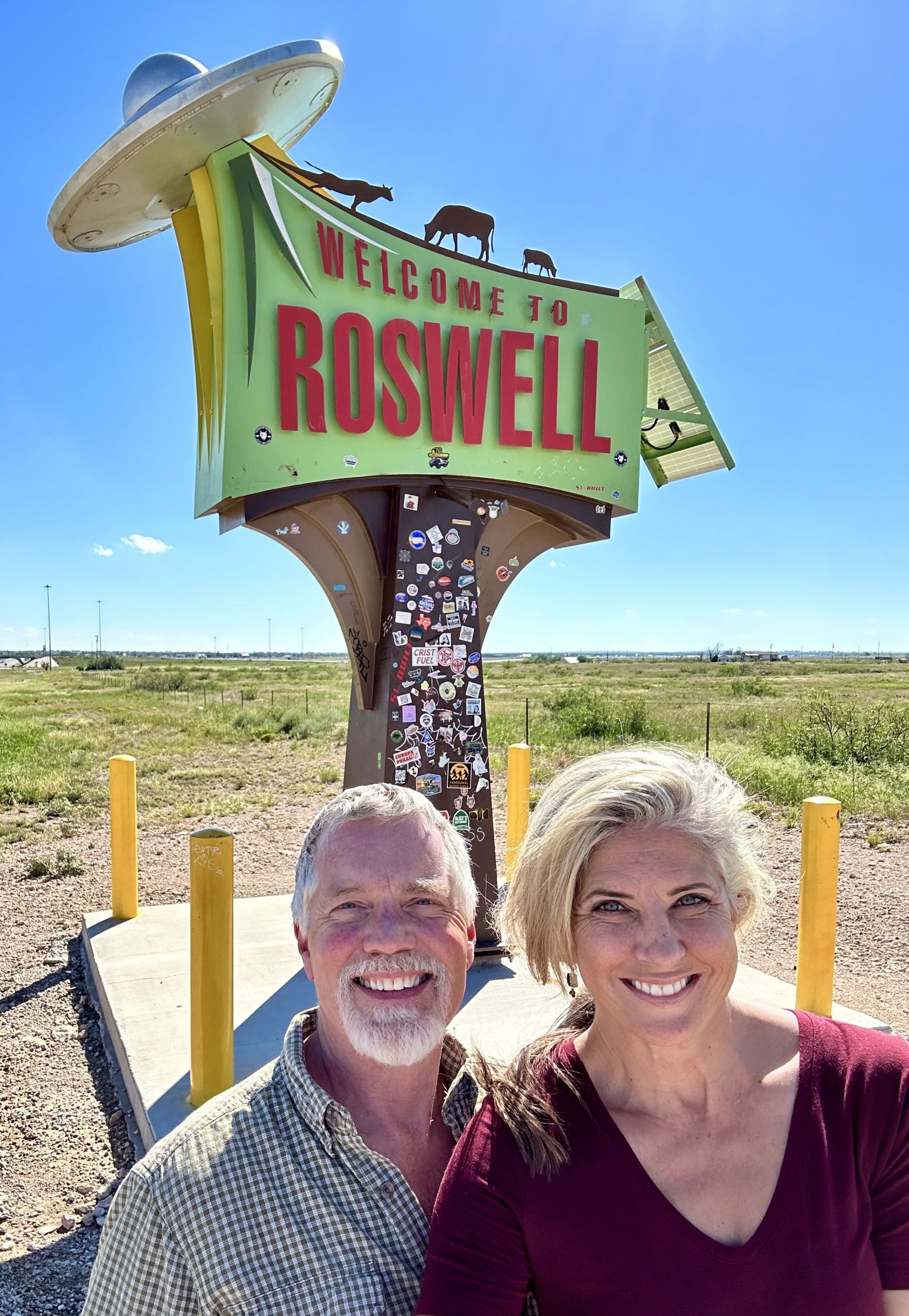 Laura and Curtis get ready to enter Roswell, New Mexico...First they stop at the Welcome to Roswell! sign.