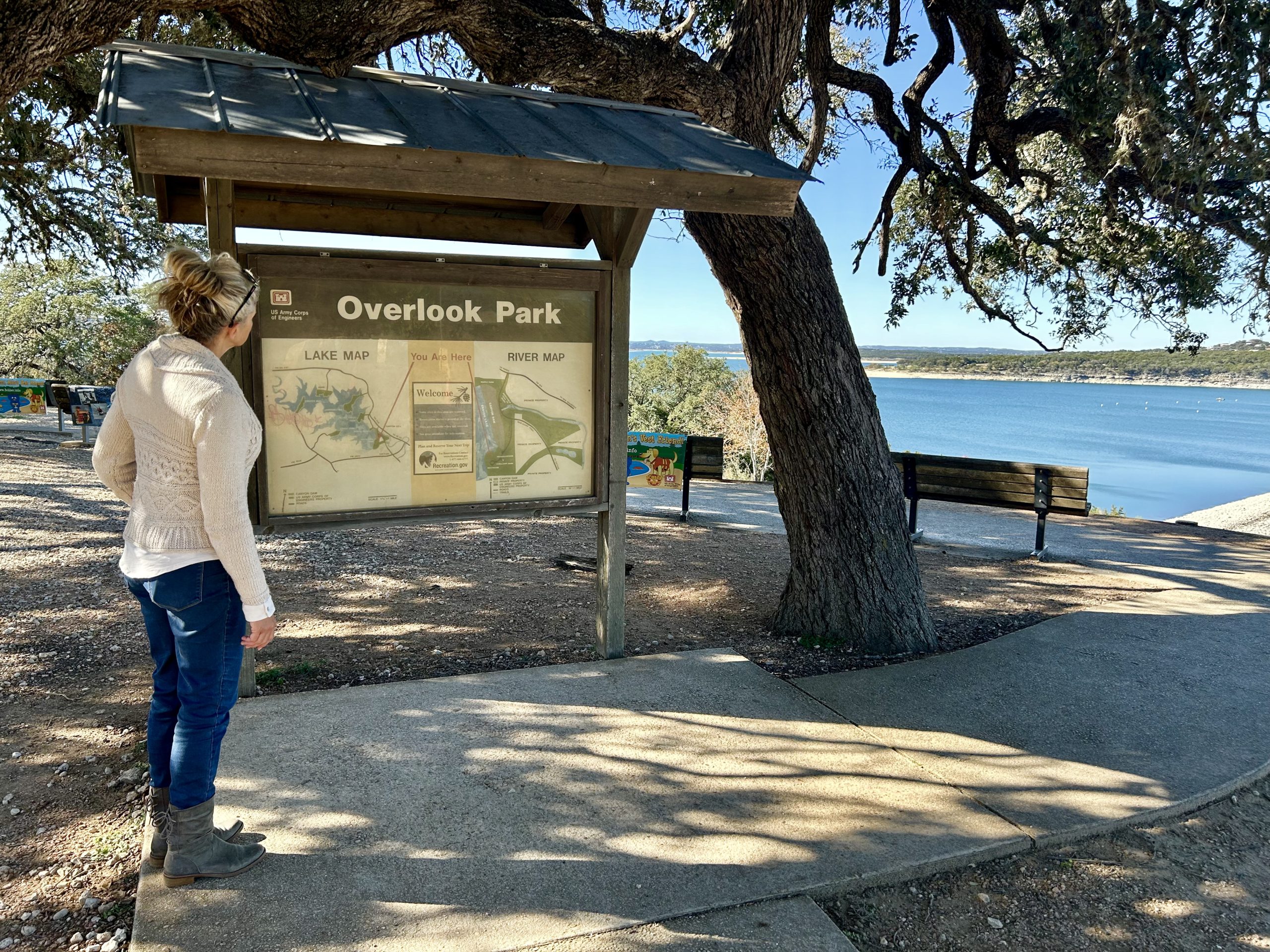 Laura studying the Overlook Park sign