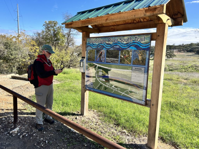 Curtis Checks Out the Sign for the Guadalupe River South Trail, Canyon Lake, Texas.