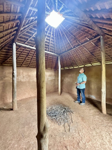 Curtis marvels at the wattle and daub construction at the Etowah Mounds Historic Site.