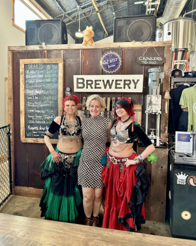 Mother and daughter belly dancers flank their instructor, who just happens to be the bar tender at 52 West Brewing in Dahlonega, GA.