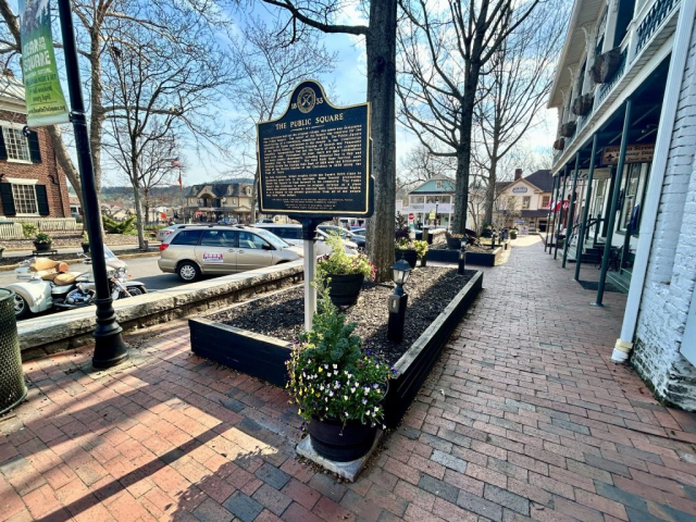 Plaque provides historical information regarding the town square in Dahlonega, GA.