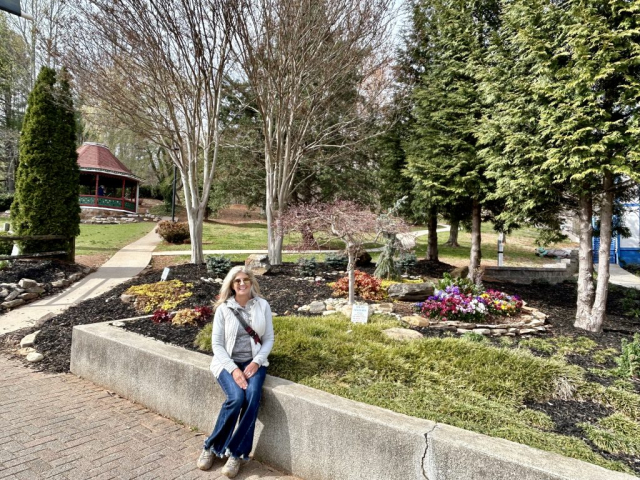 Laura at one of the many blooming flower planters in Helen, GA during March!