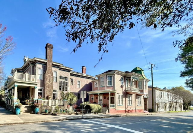 Propped on the corner, entering the East Victorian District of Savannah, Georgia, is an example of how different each home is. A smaller one, sits way back from it's larger neighbor.